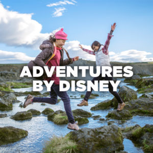 Adventures by Disney - girls skipping on rocks in stream