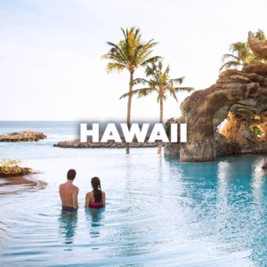 Hawaii - couple in infinity pool looking at ocean
