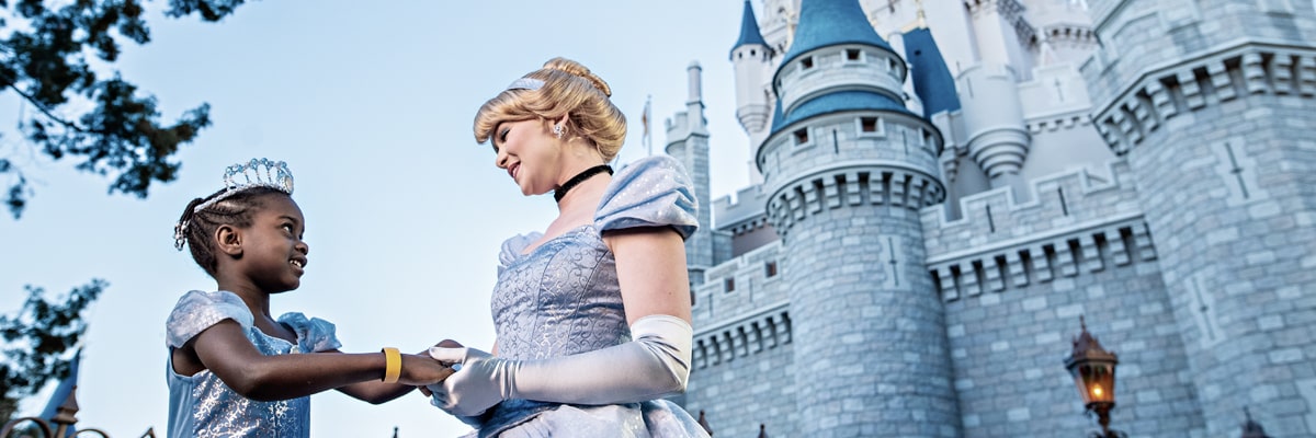 A young girl with the Disney Princess Cinderella.
